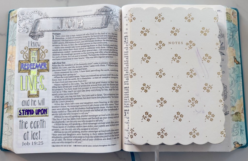 Open art journaling Bible with a Scripture reflection and coloring page used during quiet time with Jesus.